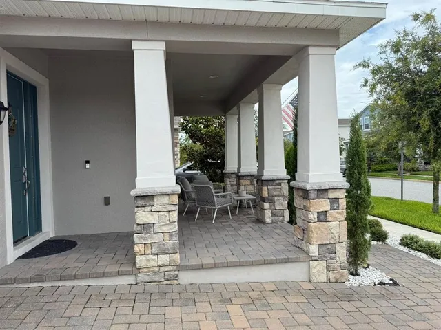 a table and chairs in front of the house