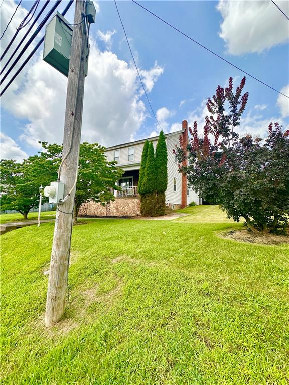 461 Walnut Hill Road Uniontown, PA 15401 - Photo 3 of 26 a view of a fountain in front of a house with a big yard