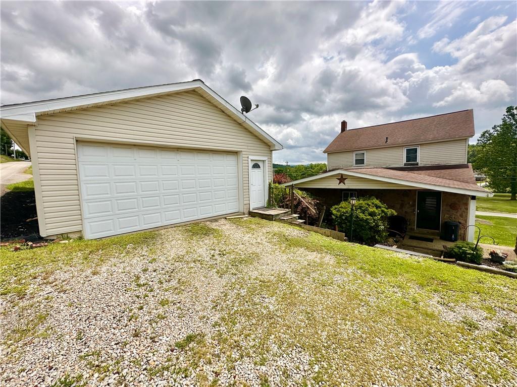 461 Walnut Hill Road Uniontown, PA 15401 - Photo 5 of 26 a view of house with yard and garage