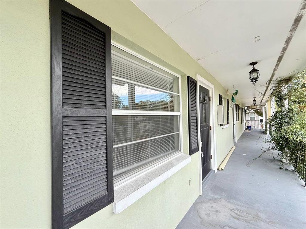 727 Milwaukee Avenue, Unit 6 Dunedin, FL 34698 - Photo 1 of 18 a view of a balcony