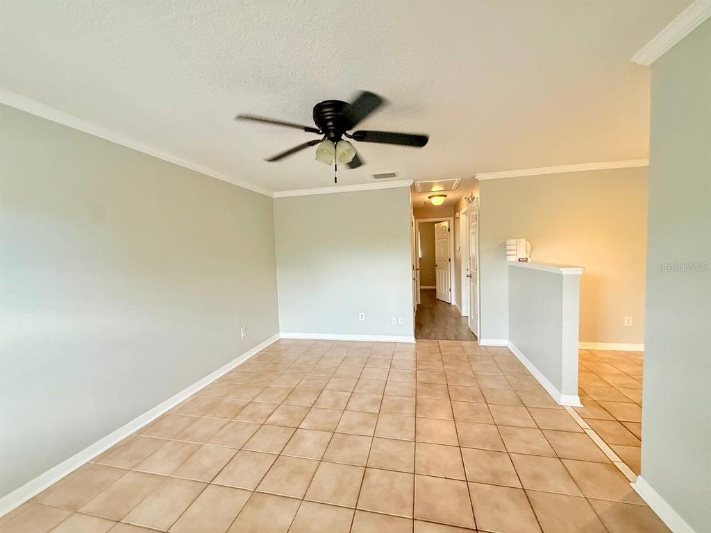727 Milwaukee Avenue, Unit 6 Dunedin, FL 34698 - Photo 5 of 18 a view of a livingroom with a staircase