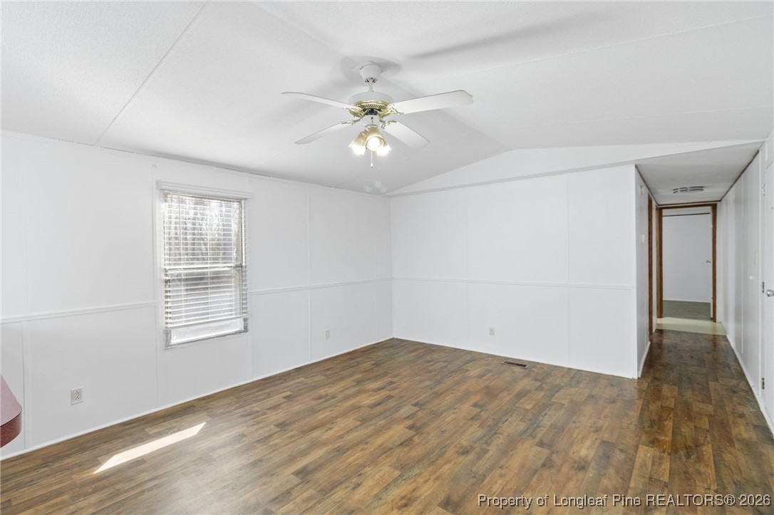 7321 Sheriff Watson Road Sanford, NC 27332 - Photo 3 of 26 wooden floor in an empty room with a window