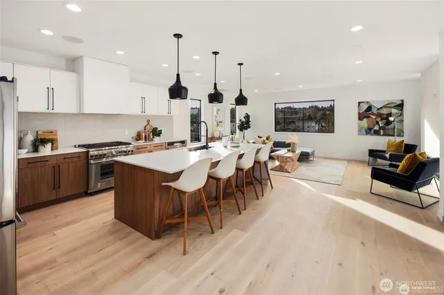 a large kitchen with a table and chairs
