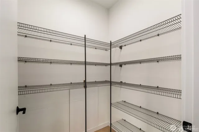 a bathroom with a shower and a glass door