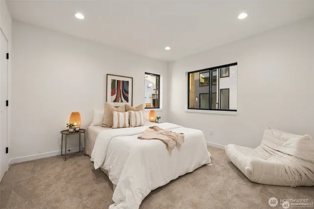 a bedroom with a bed and couch