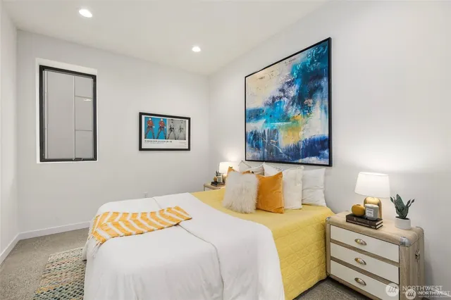 a bedroom with a bed and cupboard