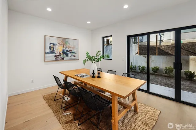 a view of a dining room with furniture window and wooden floor