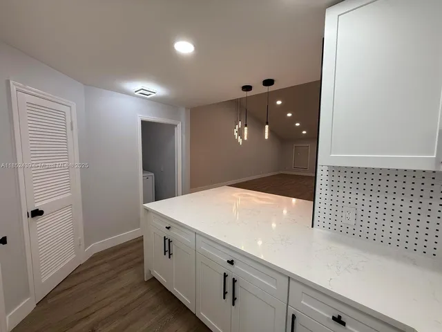 a bathroom with a sink a mirror and a shower