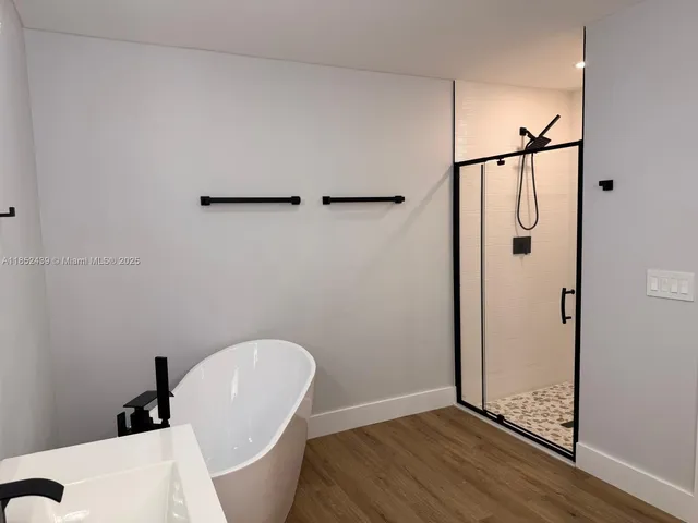 a bathroom with a bathtub and toilet