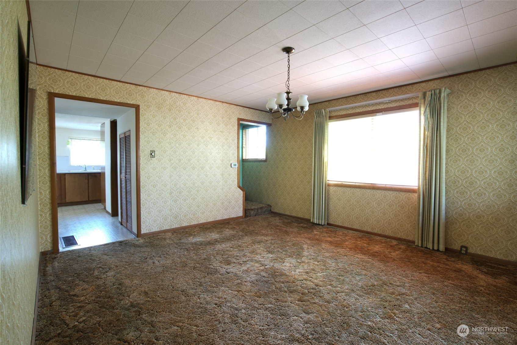 627 North Oakes Street Tacoma, WA 98406 - Photo 14 of 37 a view of empty room with wooden floor