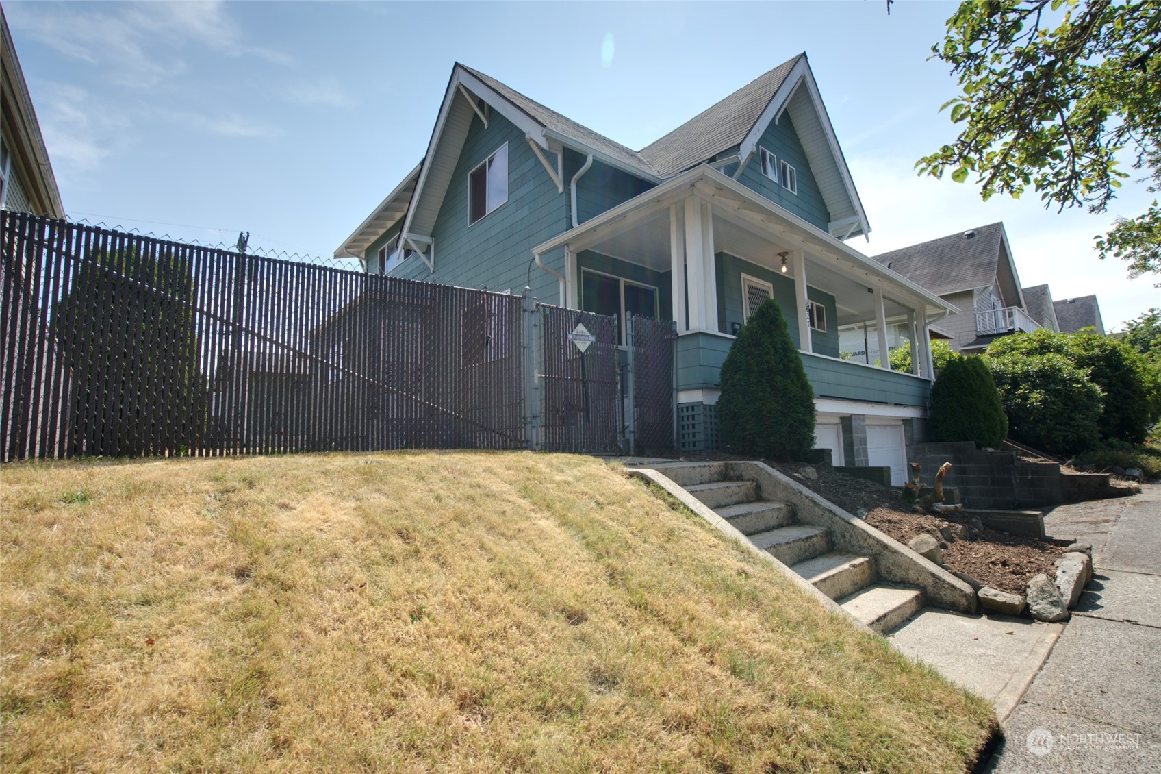 627 North Oakes Street Tacoma, WA 98406 - Photo 6 of 37 a house view with a outdoor space