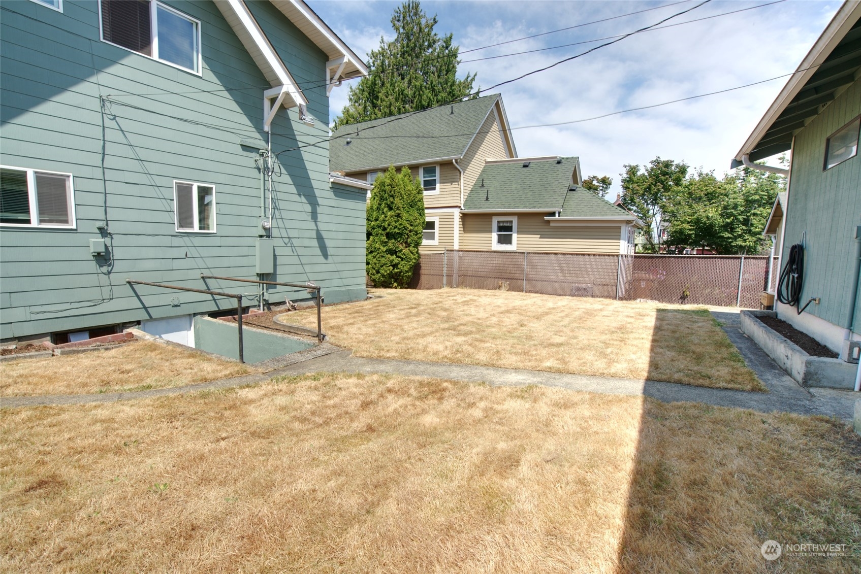 627 North Oakes Street Tacoma, WA 98406 - Photo 8 of 37 a view of house with yard and sitting area