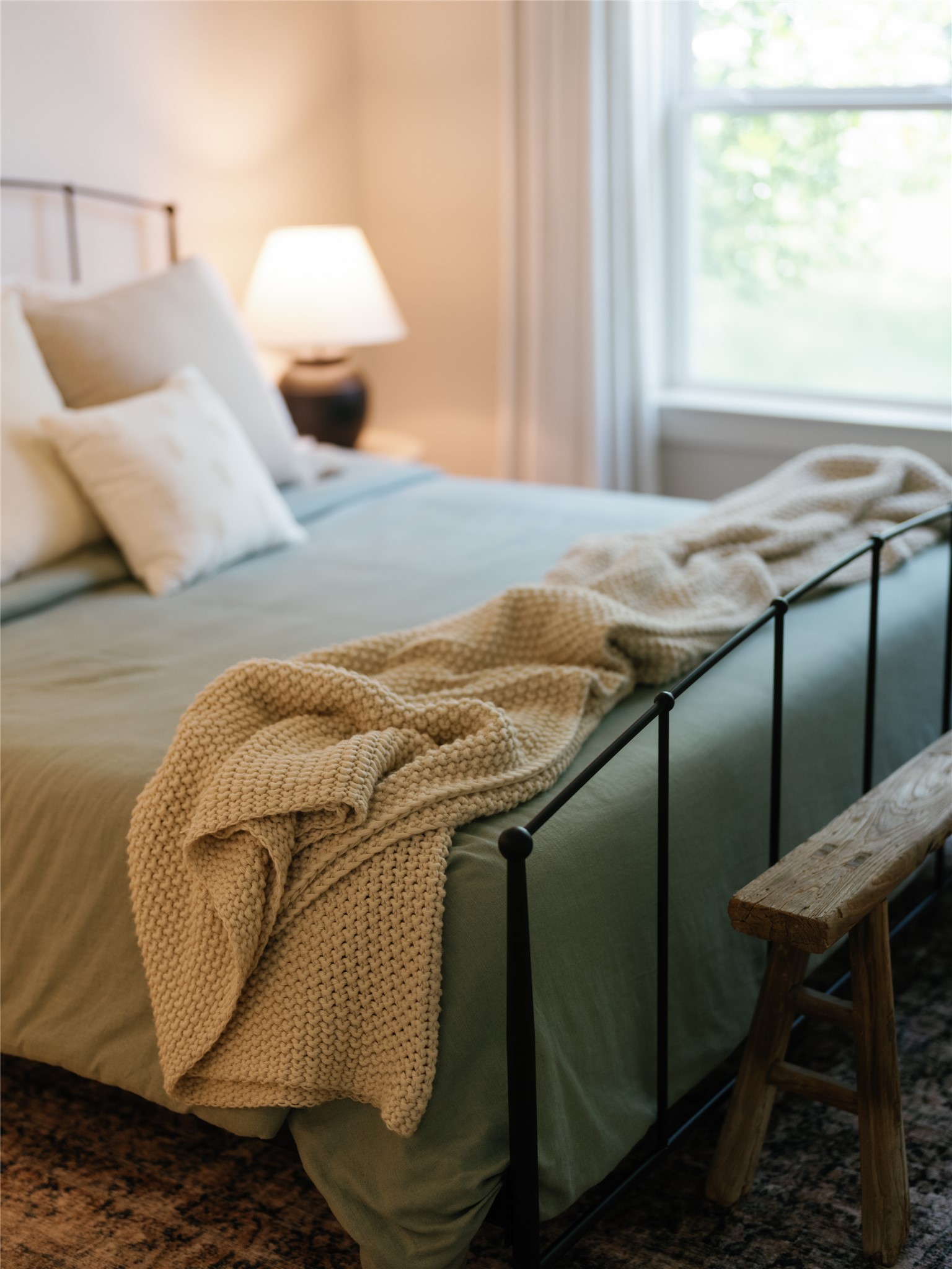 145 Eagle Pass Trail Georgetown, TX 78628 - Photo 22 of 37 A window-filled bedroom with soft, inviting bedding offers a peaceful retreat.