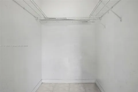 a view of a room with racks on the wall