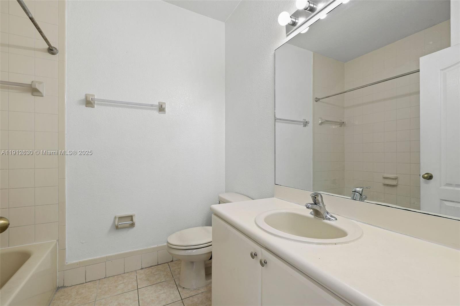 1658 Southeast 28th Court, Unit 200 Homestead, FL 33035 - Photo 13 of 20 a bathroom with a sink toilet and shower