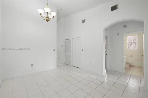 a view of an empty room with a bathroom