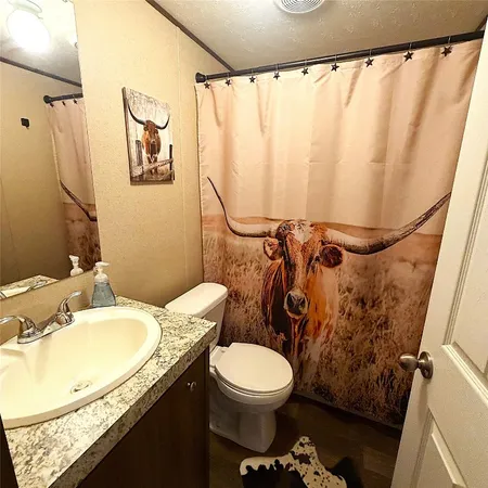 a bedroom with a bed and a table in it