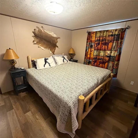 a bedroom with a bed and a table in it