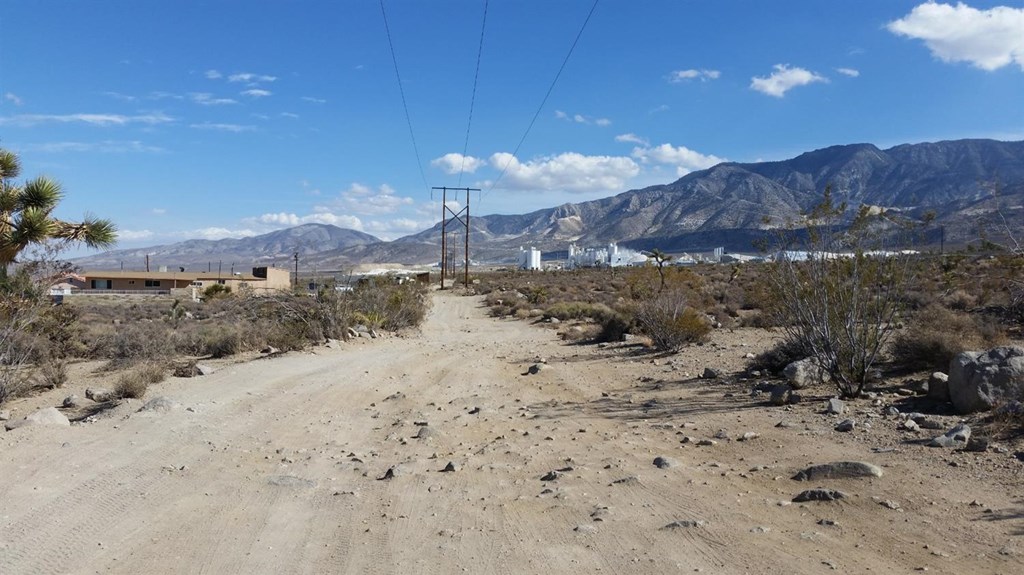 0 Powerline Road Lucerne Valley, CA 92356 - Photo 6 of 10 a view of a dry yard with mountains in the background