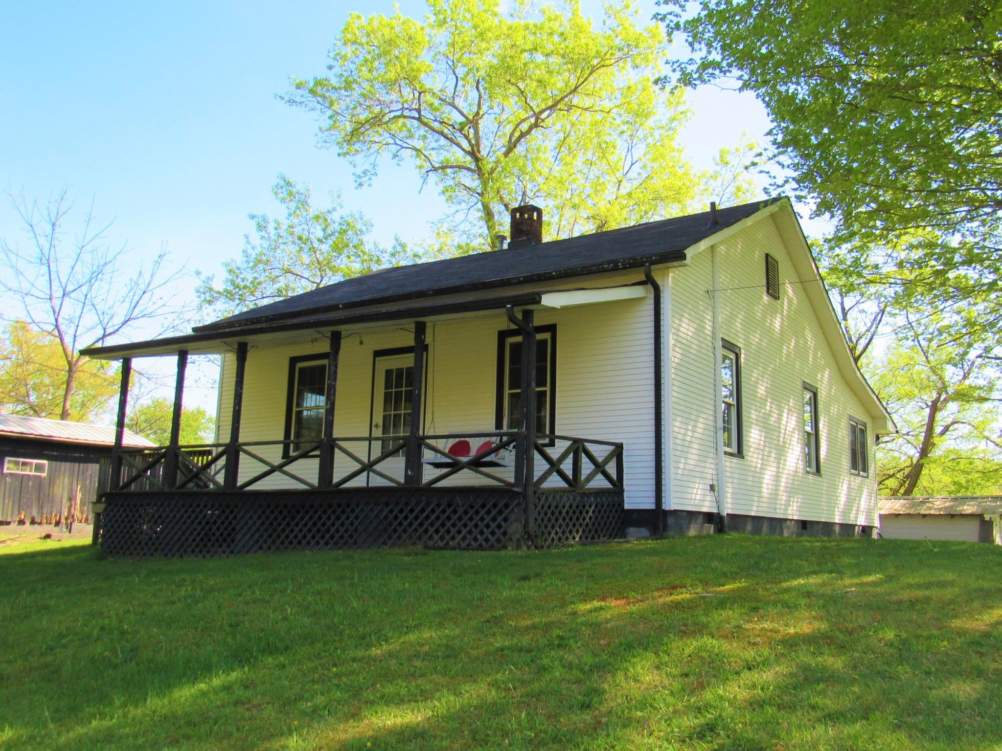 a view of a house with a backyard