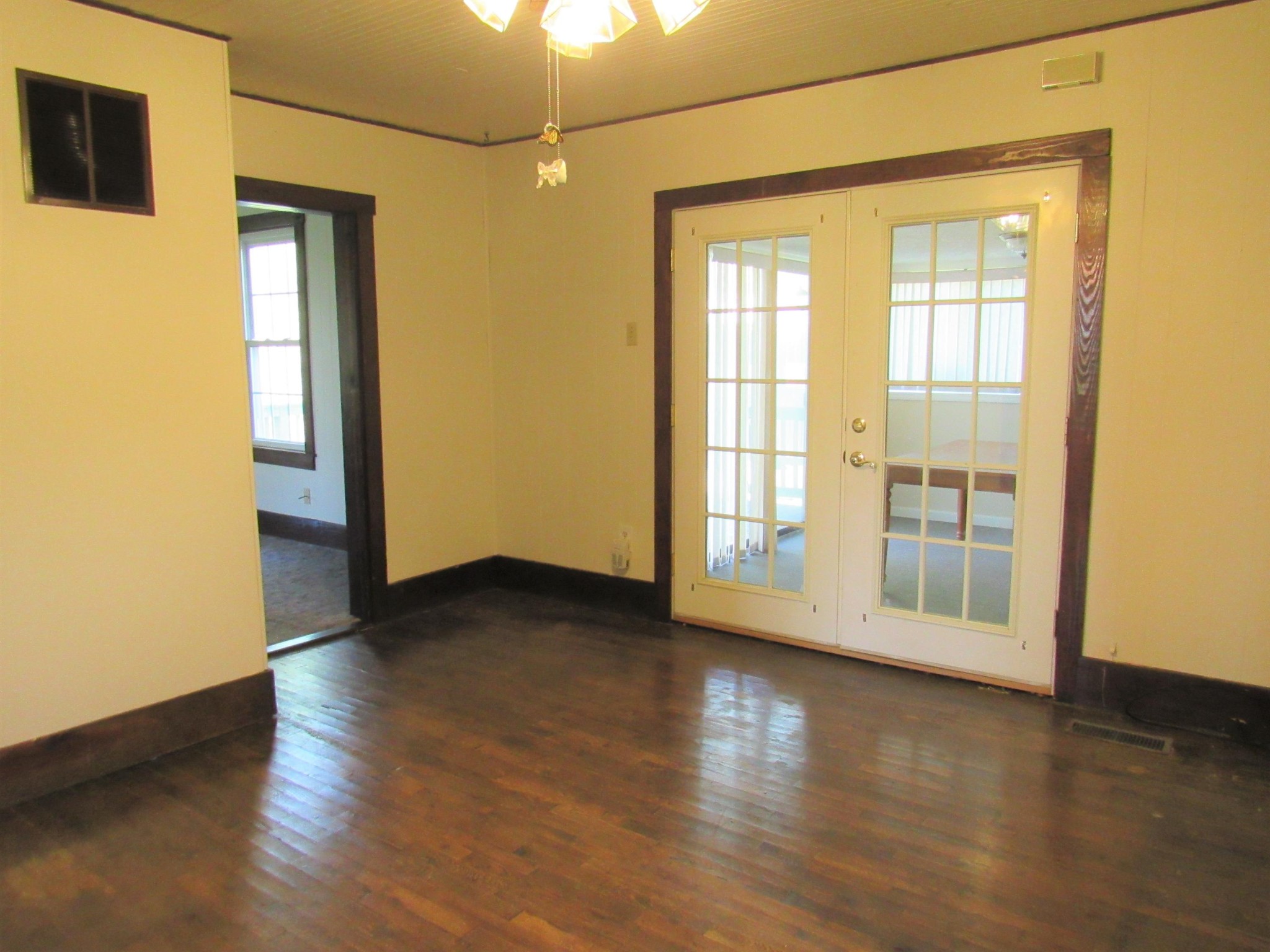 119 Andy Cooper Road Lancing, TN 37770 - Photo 11 of 35 a view of an empty room with wooden floor and a window