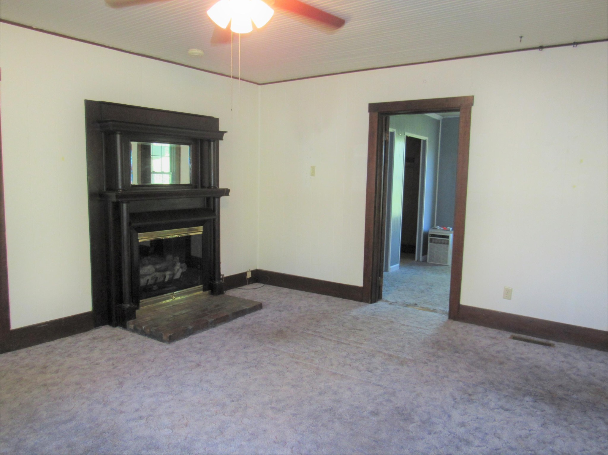 119 Andy Cooper Road Lancing, TN 37770 - Photo 14 of 35 a view of an empty room with window and fire place
