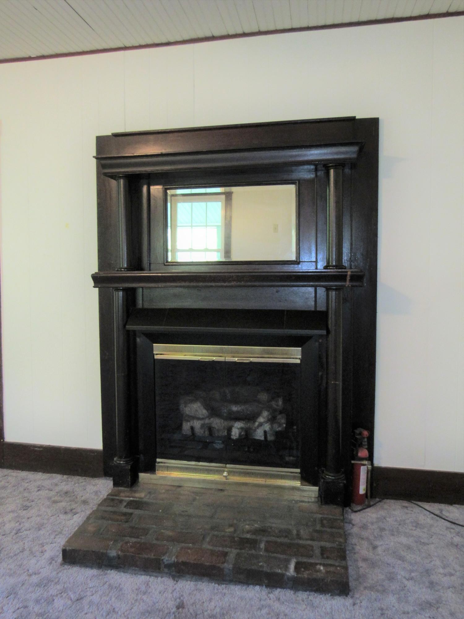 119 Andy Cooper Road Lancing, TN 37770 - Photo 17 of 35 a living room with a fireplace in it