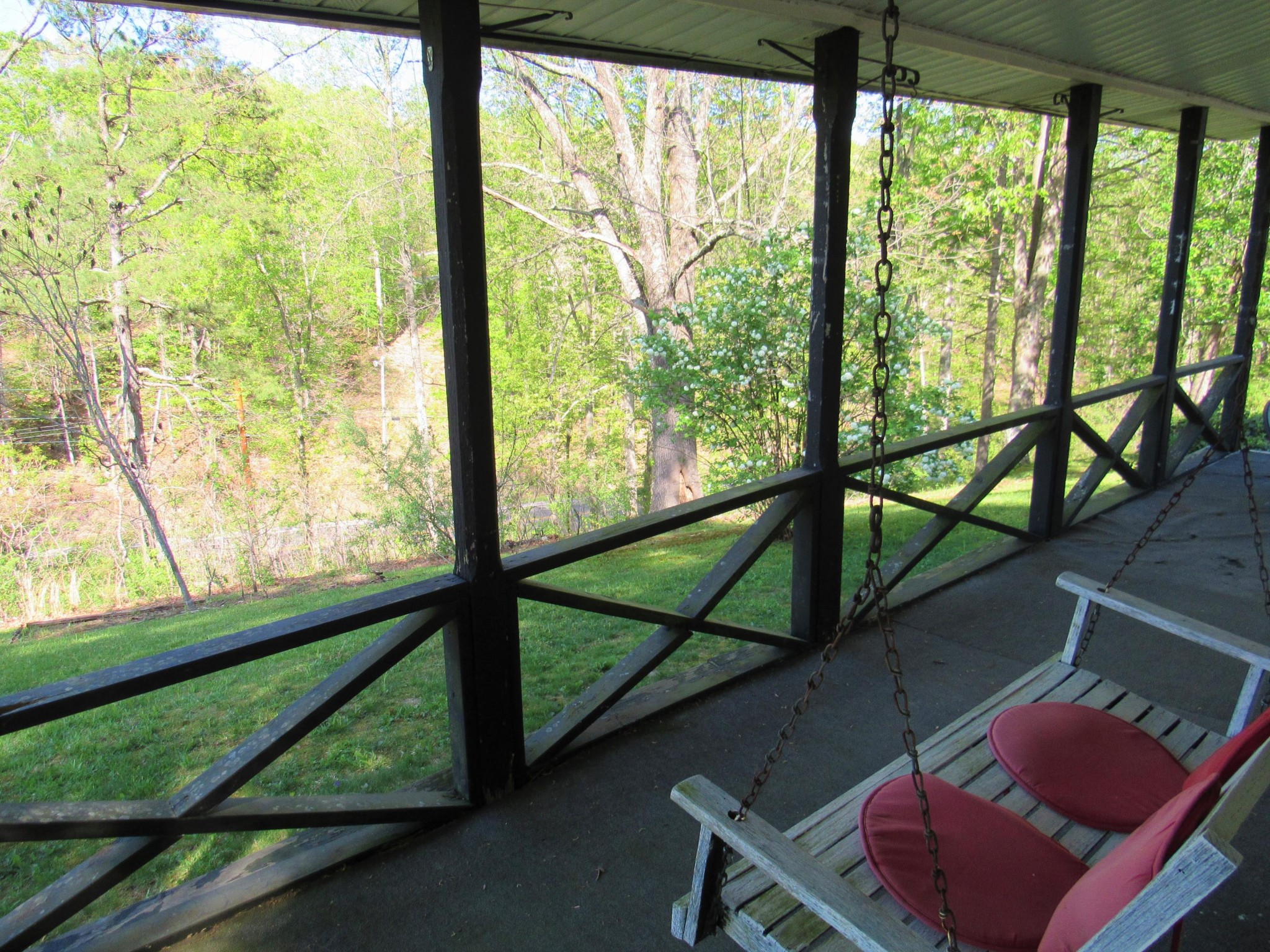 119 Andy Cooper Road Lancing, TN 37770 - Photo 23 of 35 a view of a porch with furniture and the backyard