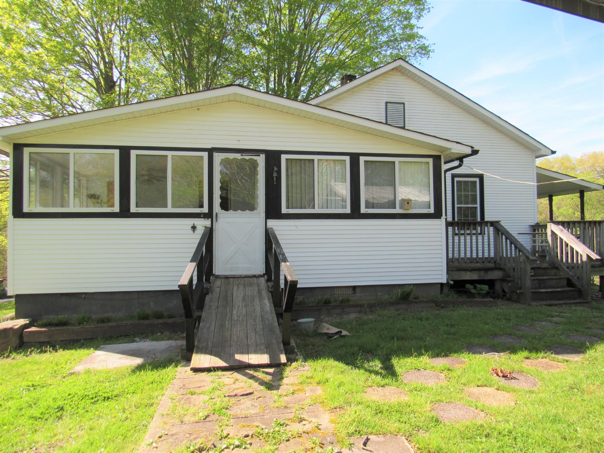 119 Andy Cooper Road Lancing, TN 37770 - Photo 3 of 35 a front view of a house with a yard