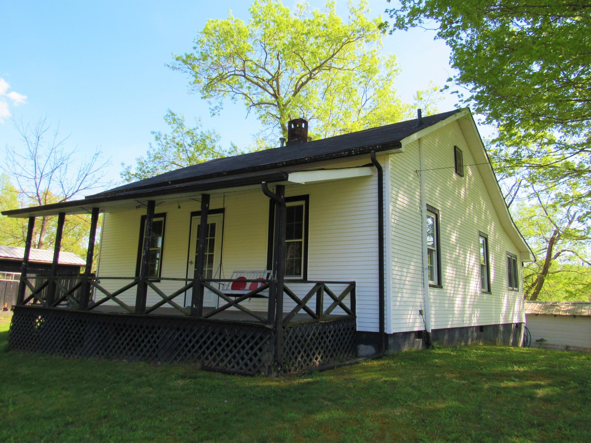 119 Andy Cooper Road Lancing, TN 37770 - Photo 32 of 35 a front view of a house with garden