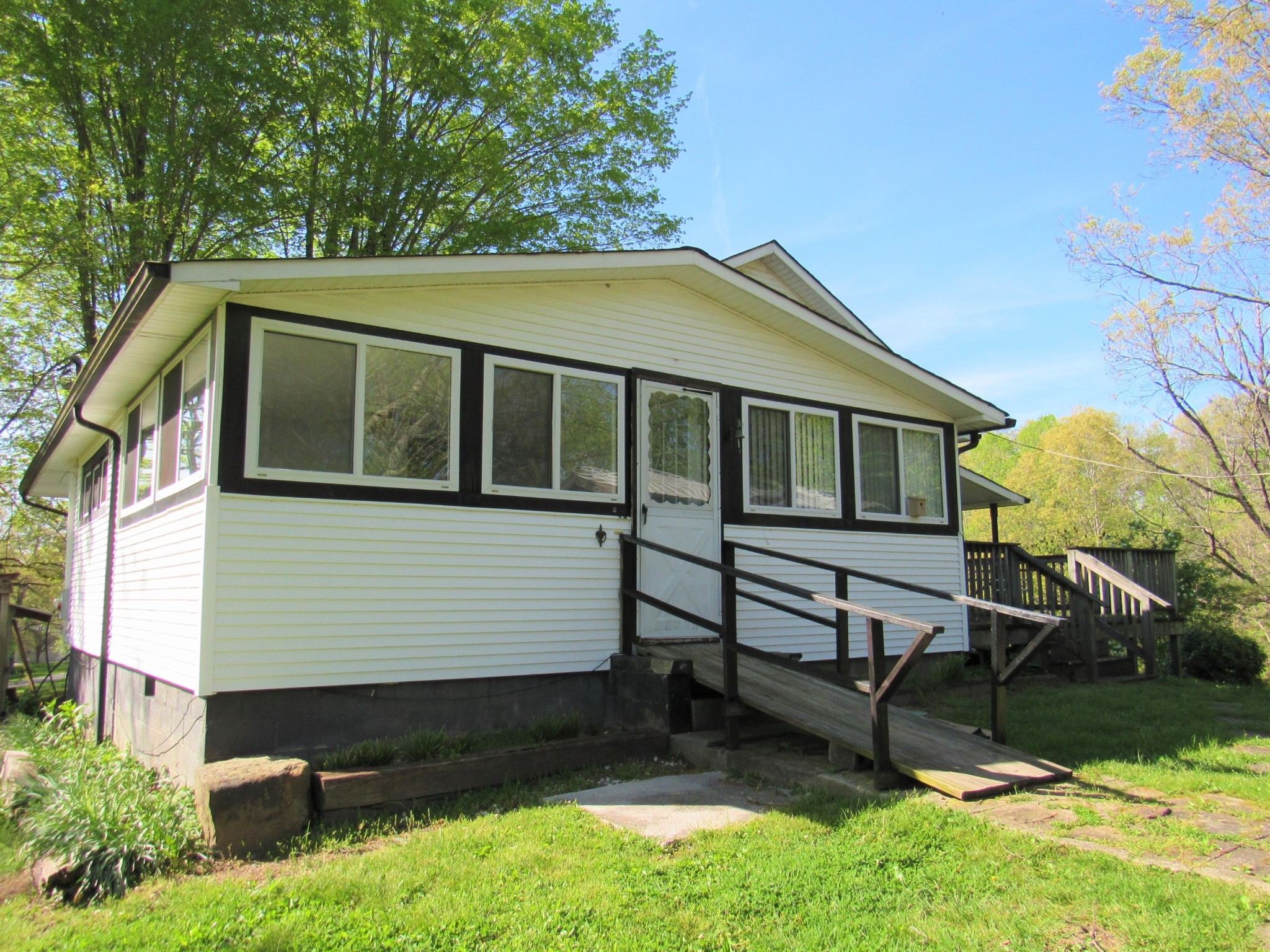 119 Andy Cooper Road Lancing, TN 37770 - Photo 34 of 35 a view of a house with a yard