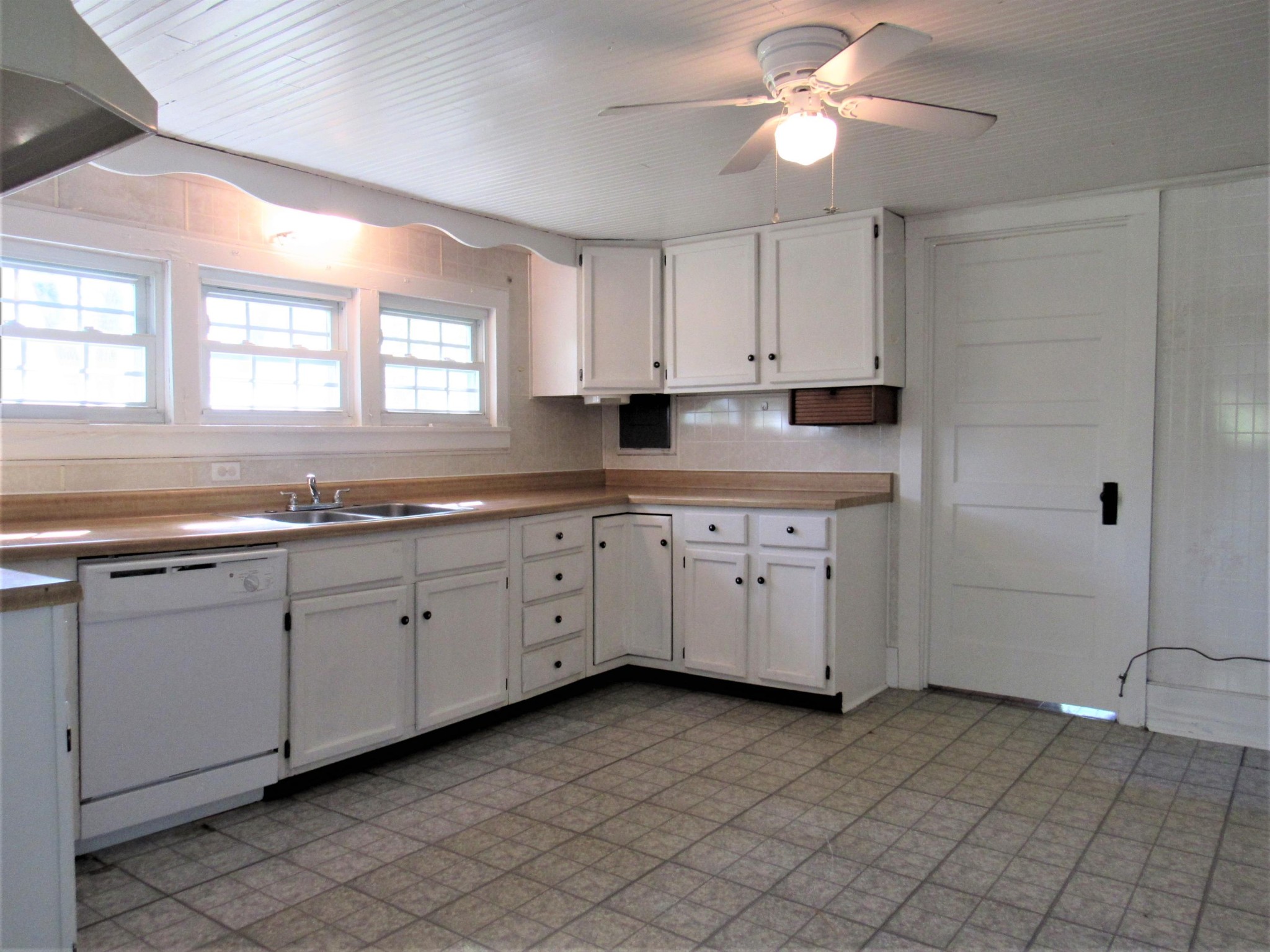 119 Andy Cooper Road Lancing, TN 37770 - Photo 4 of 35 a kitchen with a sink cabinets and window