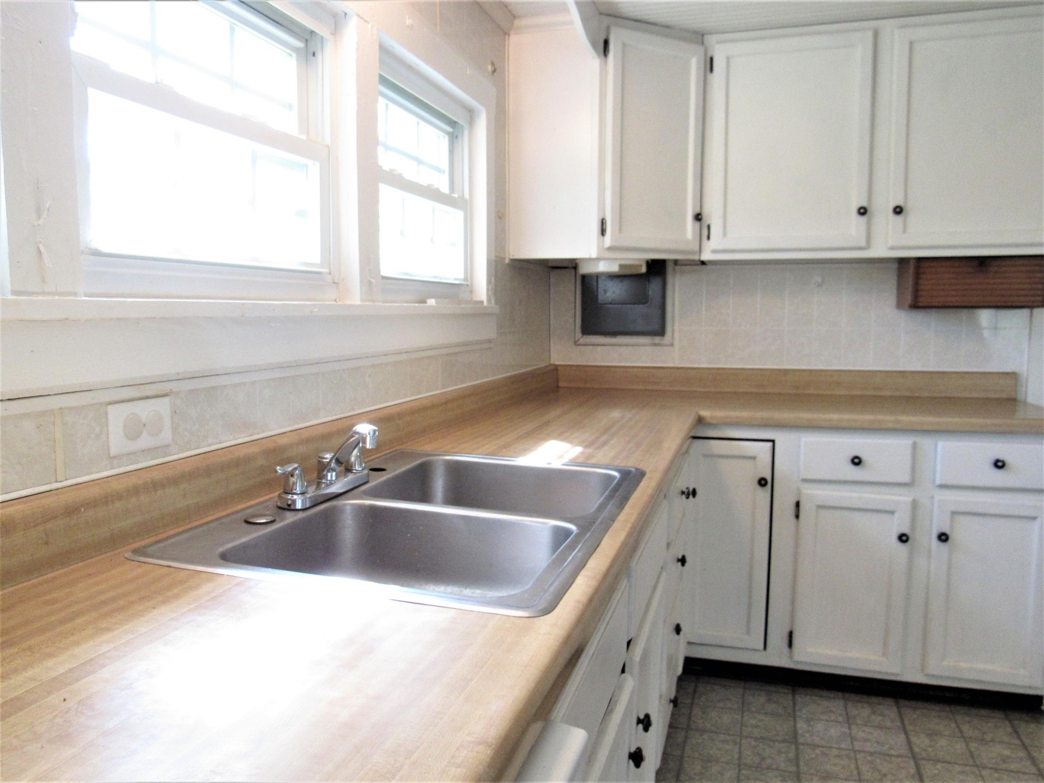 119 Andy Cooper Road Lancing, TN 37770 - Photo 6 of 35 a view white cabinets with sink and dishwasher