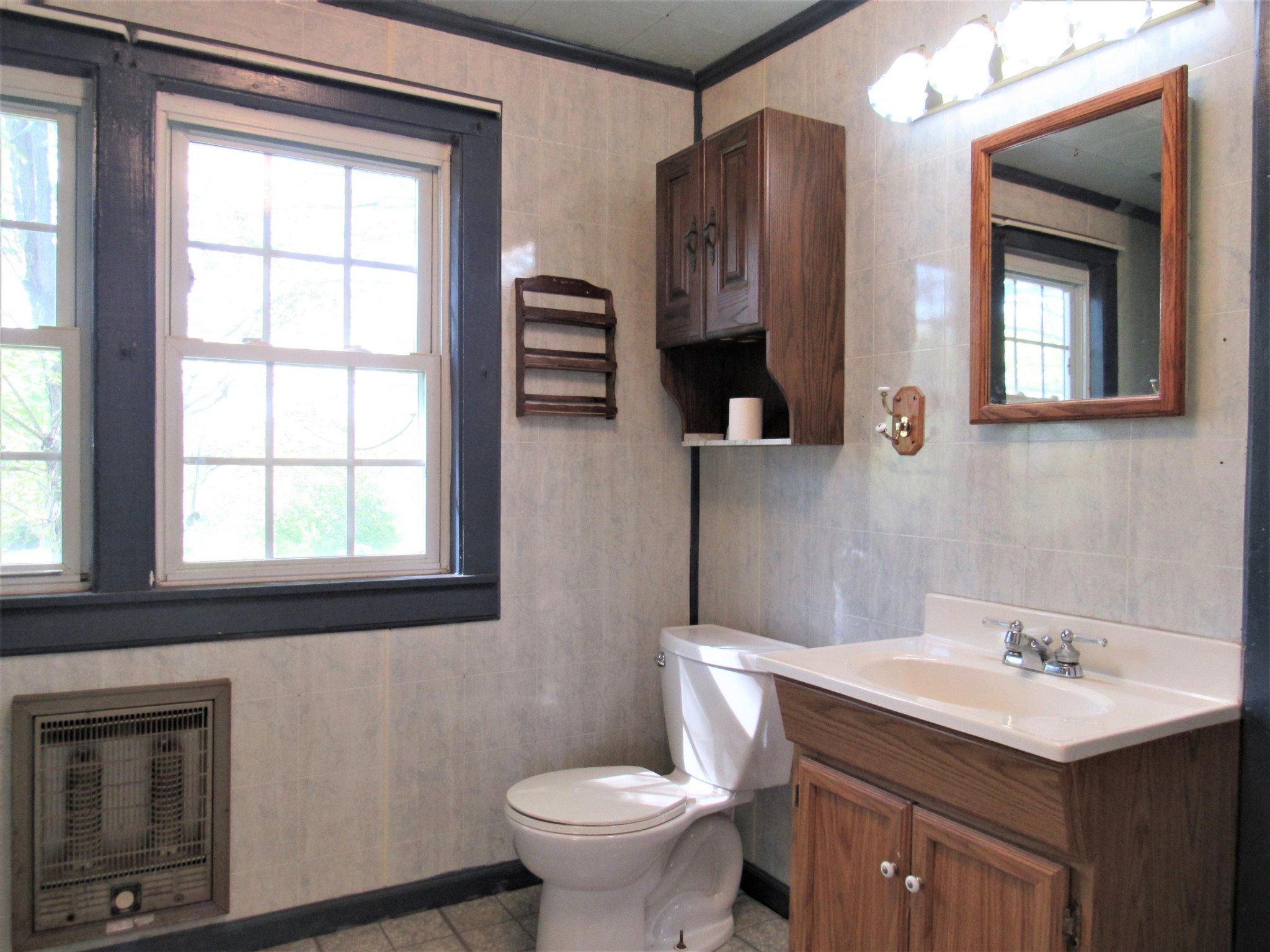 119 Andy Cooper Road Lancing, TN 37770 - Photo 8 of 35 a bathroom with a toilet sink and mirror