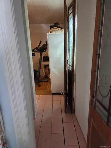 a kitchen with kitchen island granite countertop a sink stove and refrigerator