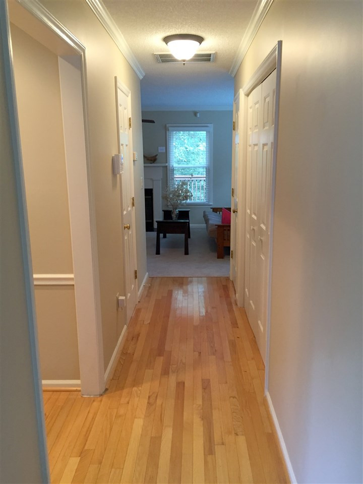 Sunny toned hardwood flooring welcomes you into this fresh and comfortable two story townhome. Entry/Hallway