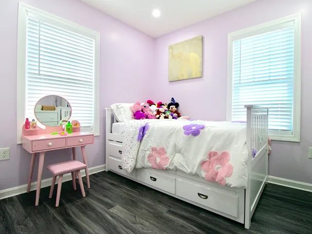 a bedroom with a bed and a table in it