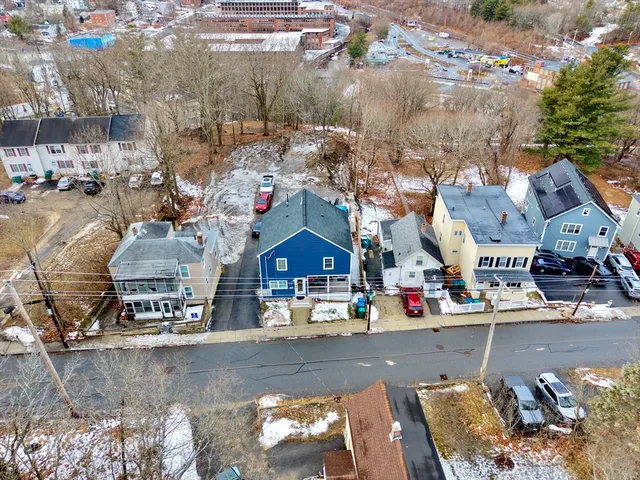 an aerial view of a house with outdoor space