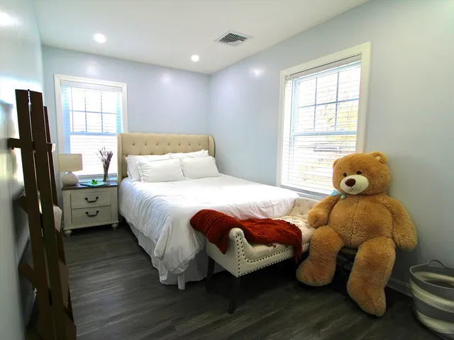 a bed room with bed and a window