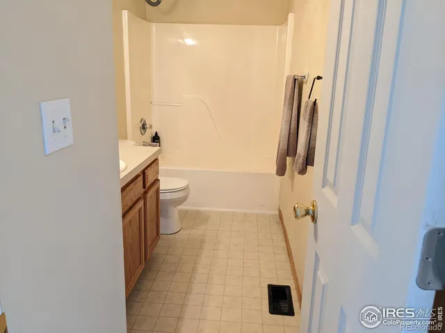 a view of wooden floor with a chair