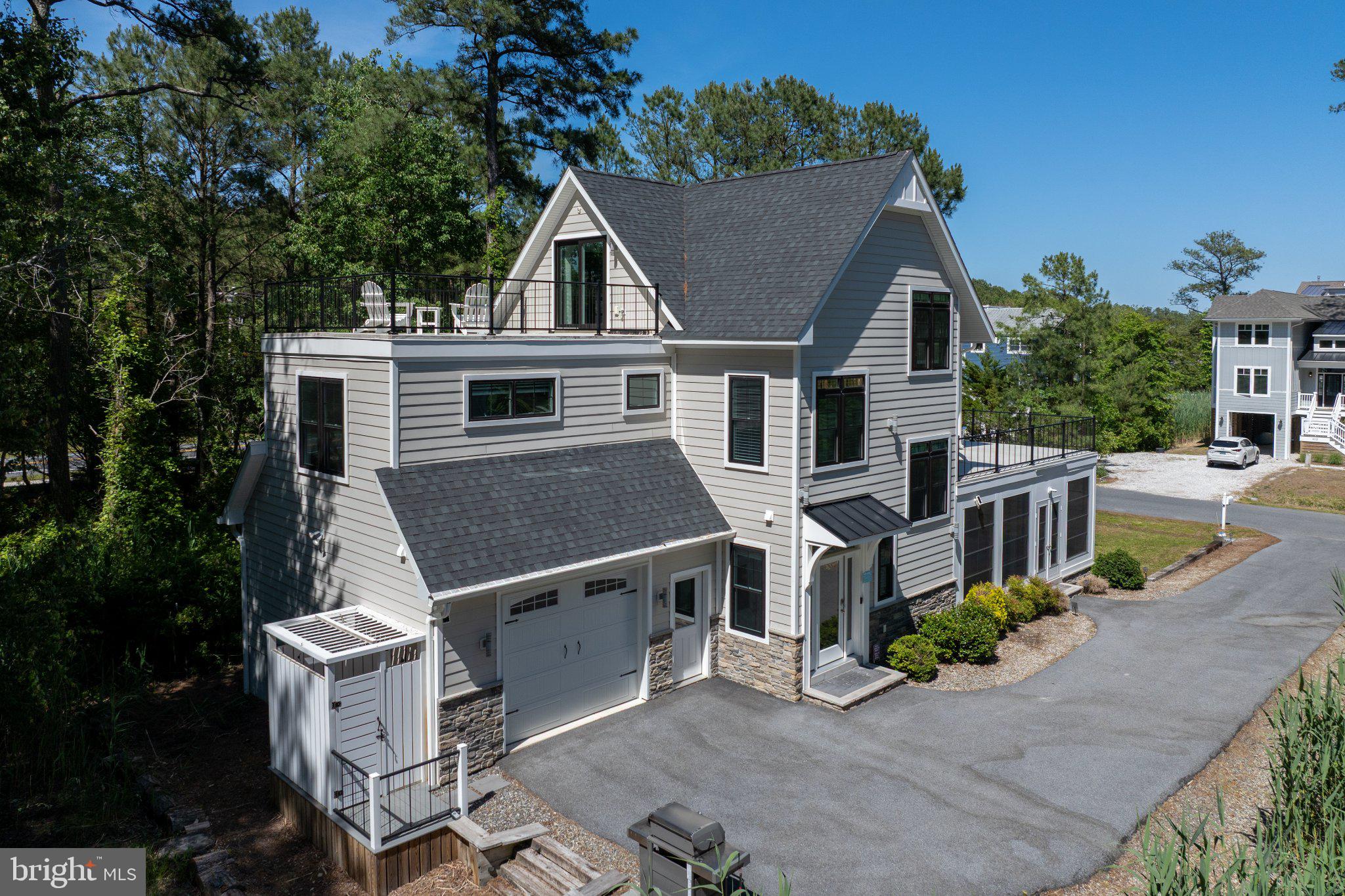 402 Salt Pond Road Bethany Beach, DE 19930 - Photo 4 of 55 Modern home with scenic surroundings.