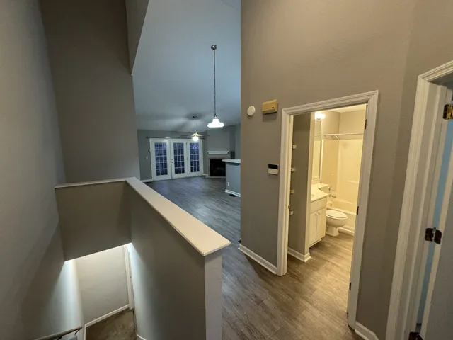 workspace with wooden floor and windows