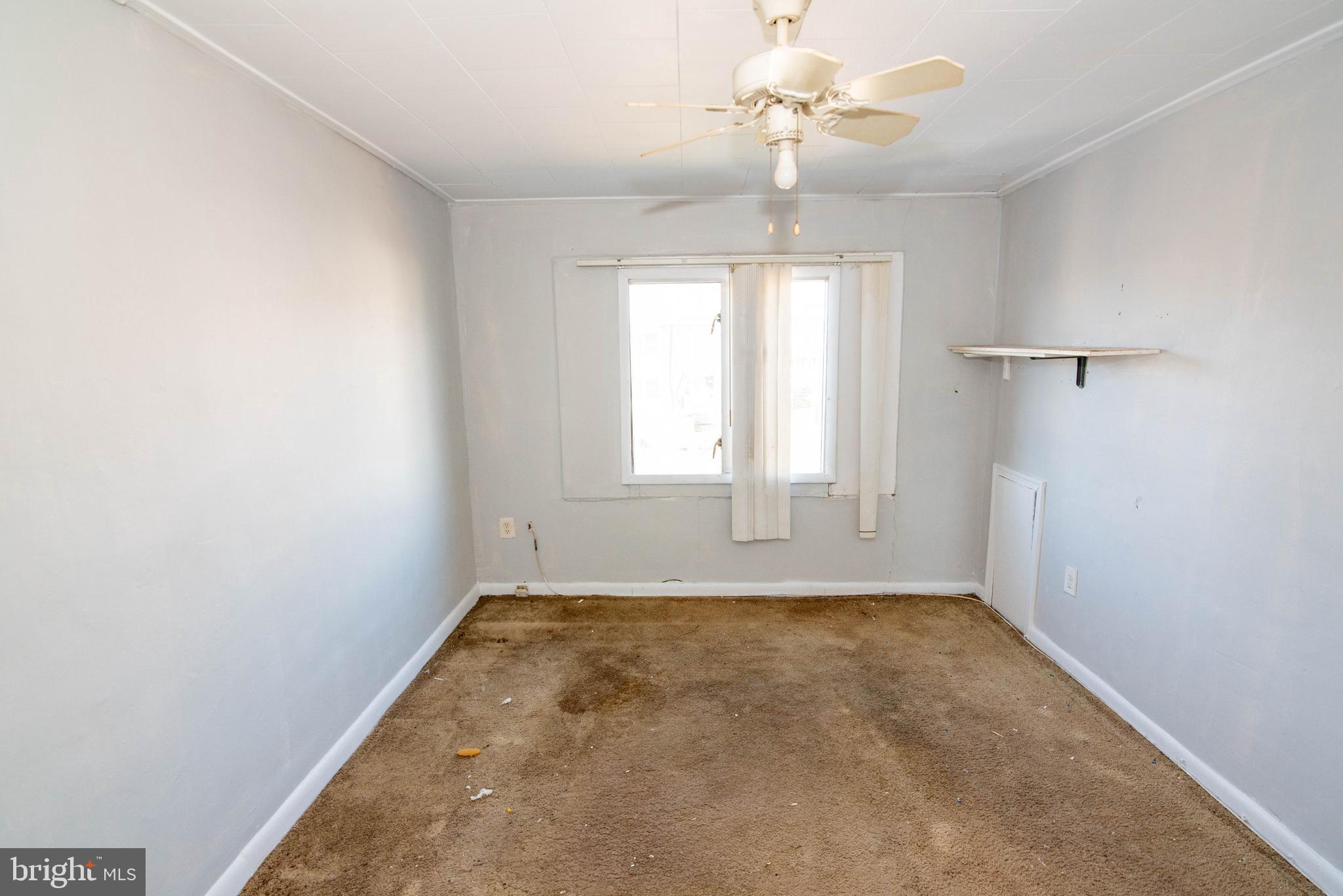 2038 Larkhall Road Dundalk, MD 21222 - Photo 14 of 28 wooden floor in an empty room with a window