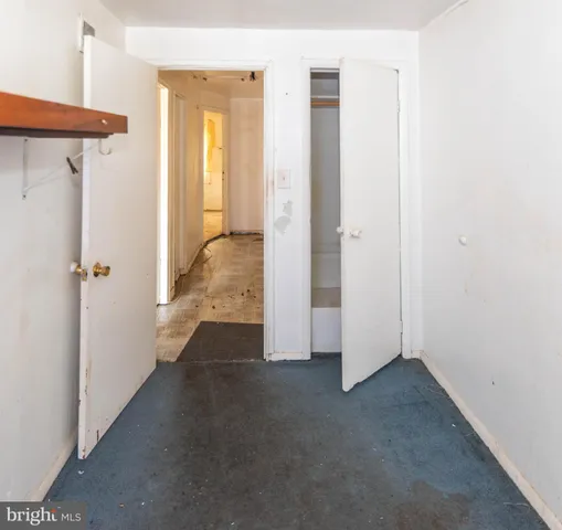 a view of a big room with table and chairs