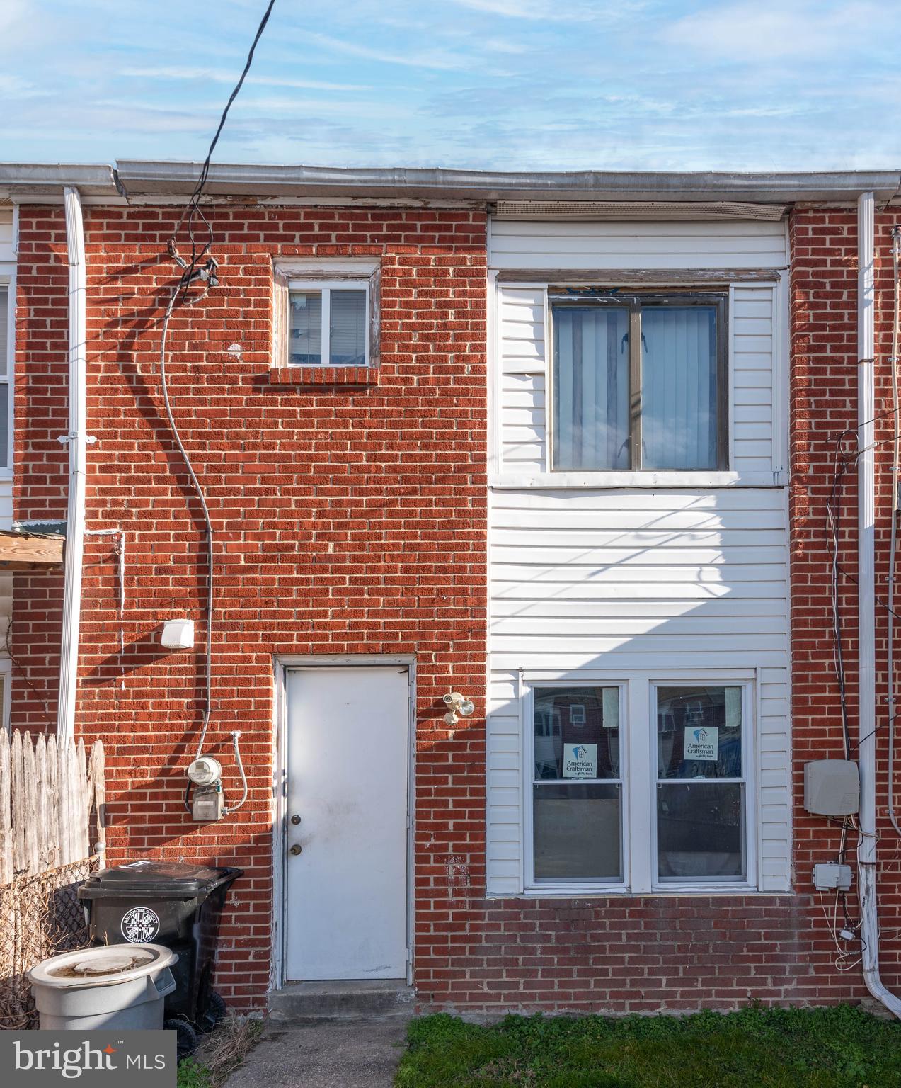 2038 Larkhall Road Dundalk, MD 21222 - Photo 22 of 28 a brick house with a door and a yard