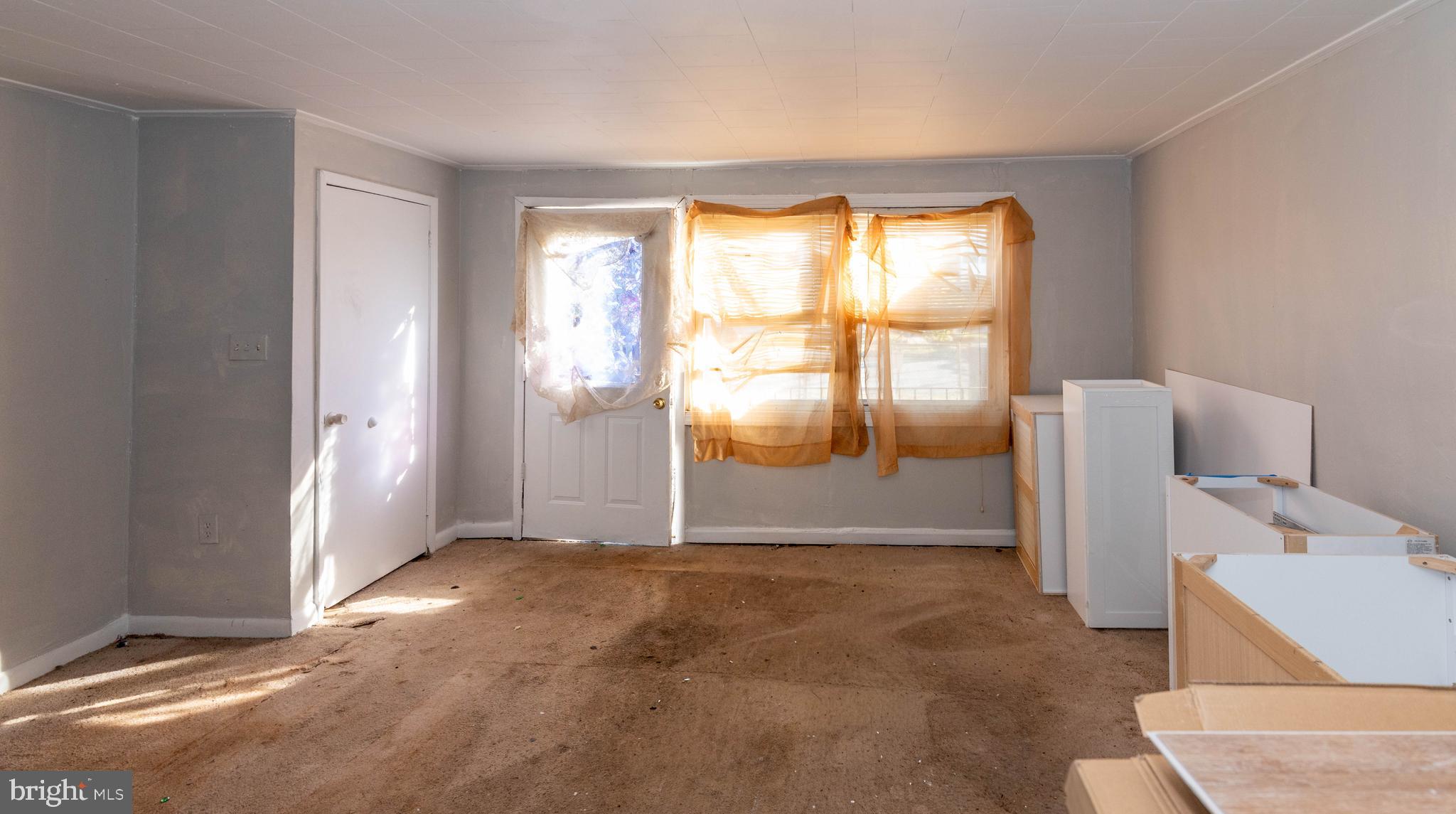 2038 Larkhall Road Dundalk, MD 21222 - Photo 5 of 28 a view of an empty room with a window