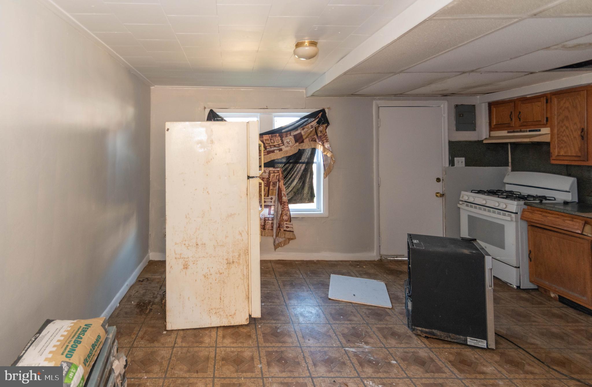 2038 Larkhall Road Dundalk, MD 21222 - Photo 7 of 28 a view of a kitchen with refrigerator and wooden floor
