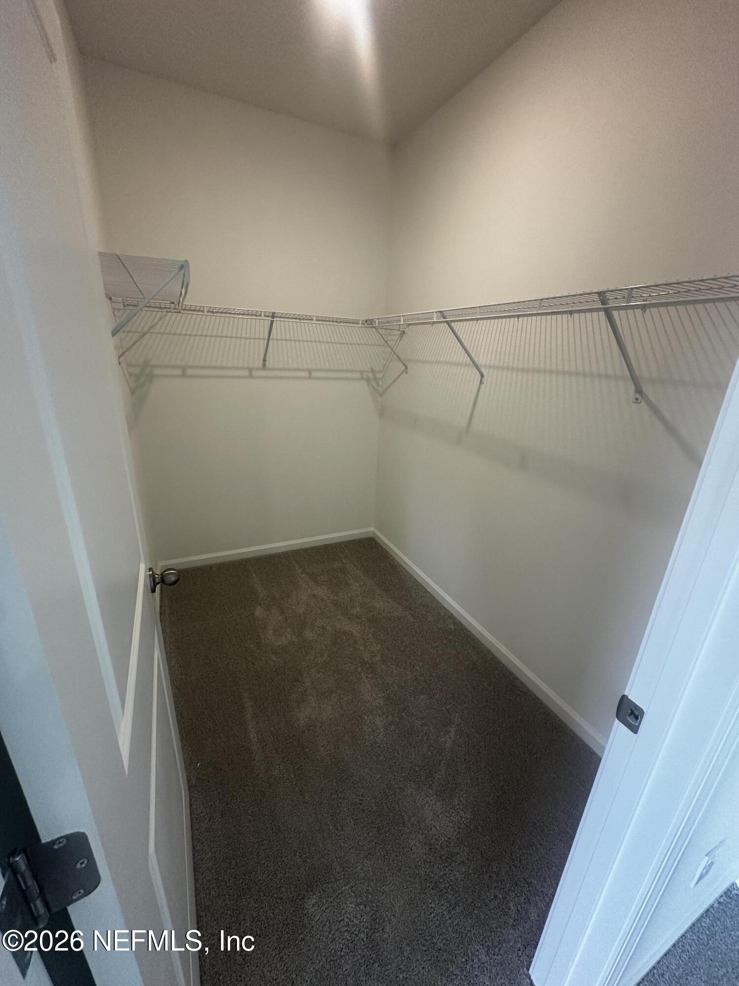 54 Oriole Road Palm Coast, FL 32137 - Photo 13 of 23 a view of a room with racks on the wall