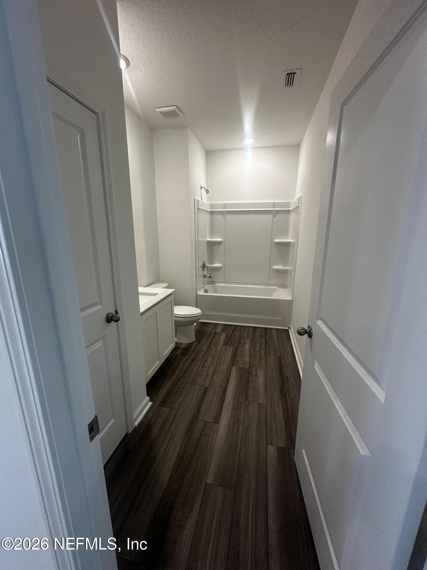 54 Oriole Road Palm Coast, FL 32137 - Photo 15 of 23 a bathroom with a sink and a toilet