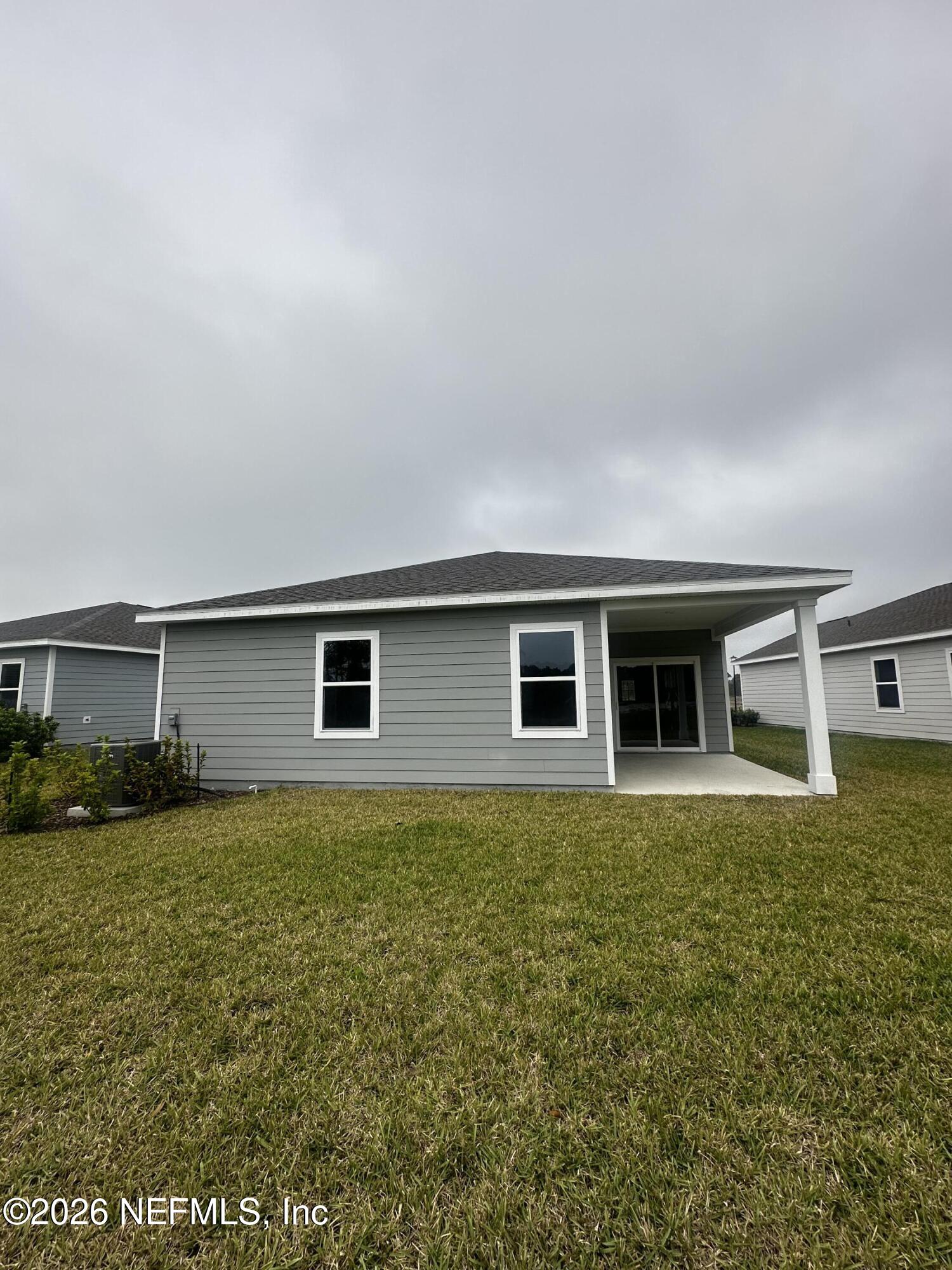 54 Oriole Road Palm Coast, FL 32137 - Photo 20 of 23 a house view with a garden space